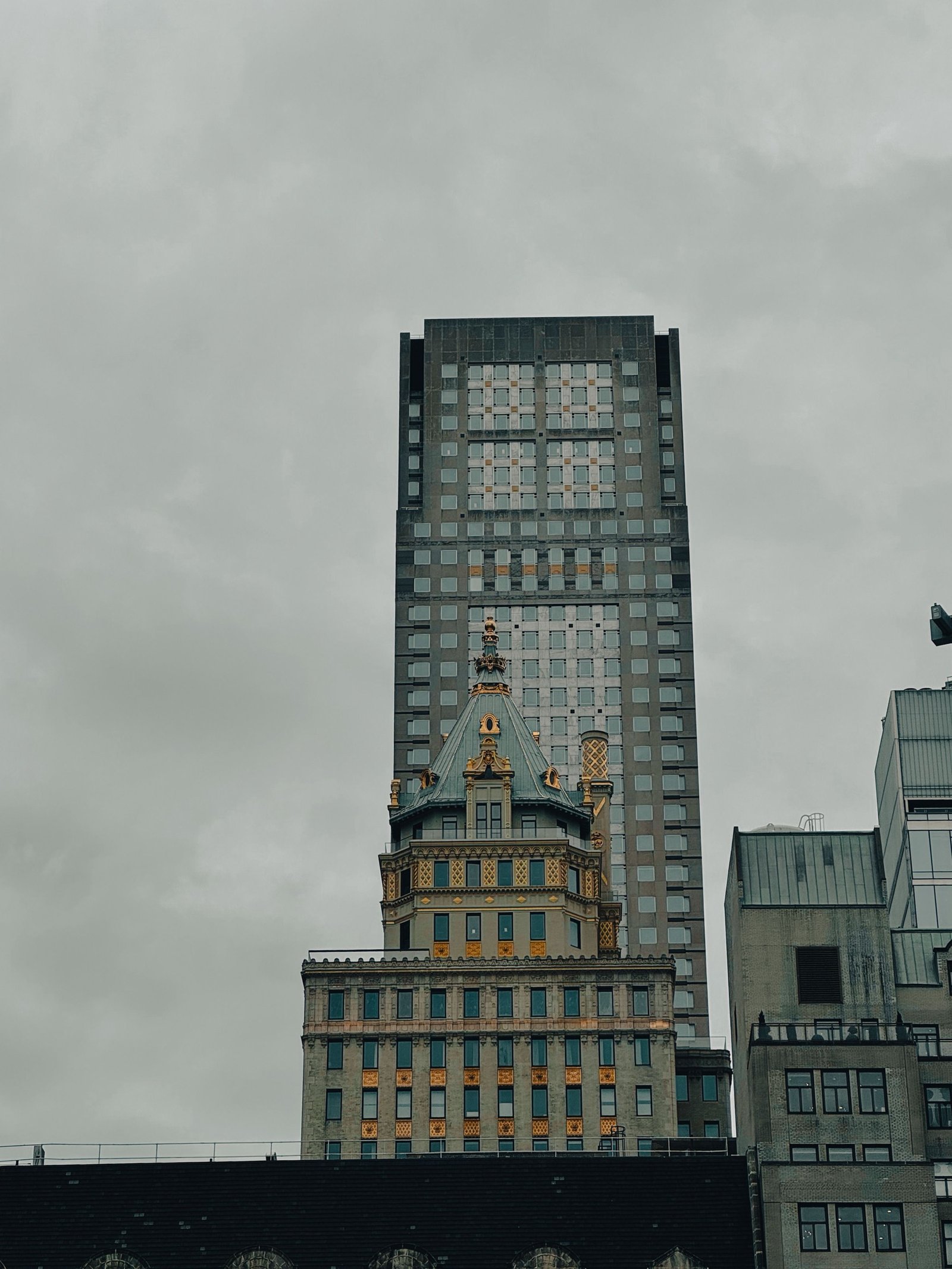 Ornate Beaux-Arts tower against the New York City skyline